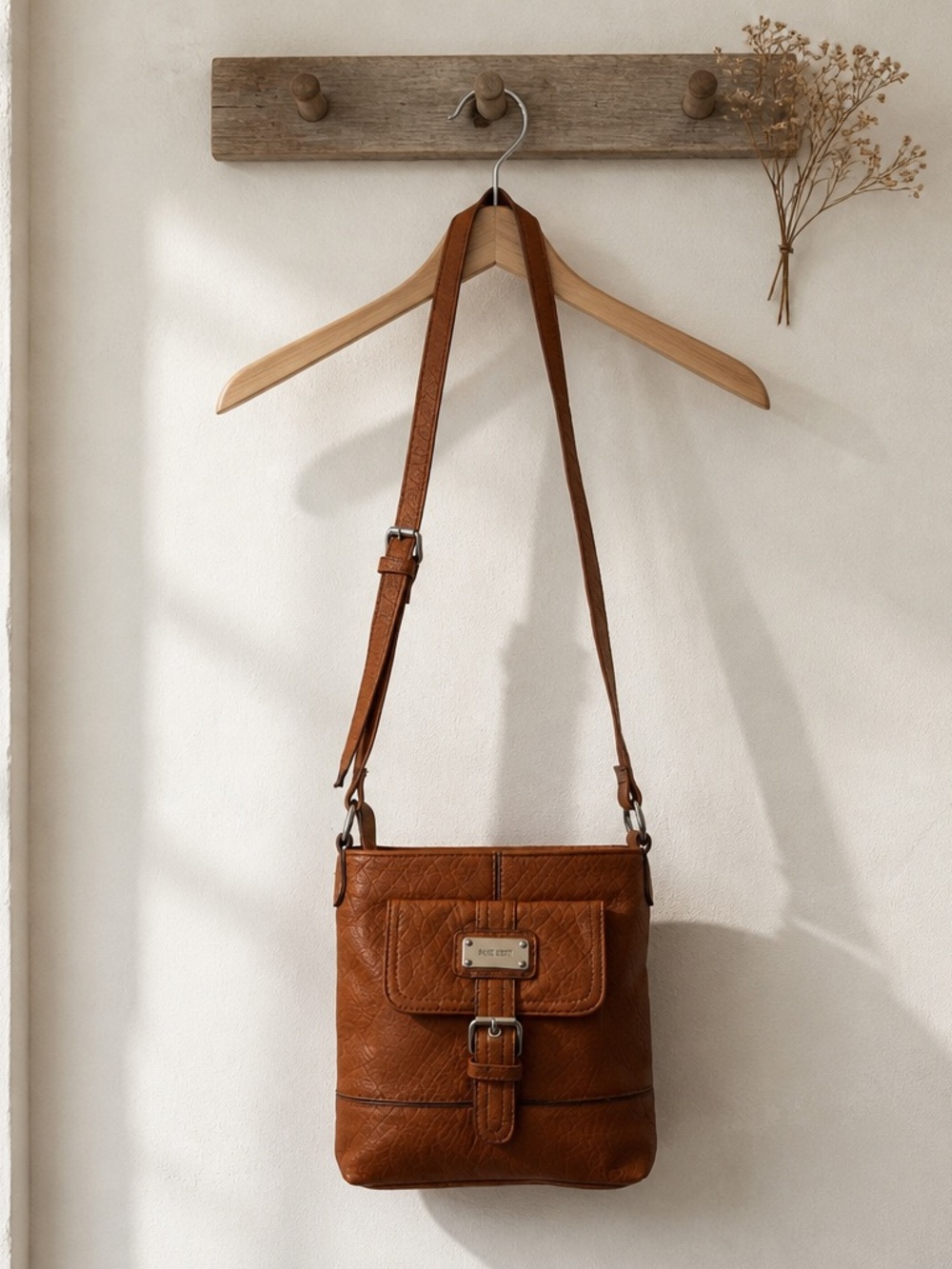 Nine West Rocky mini crossbody bag featuring a textured finish flap pocket